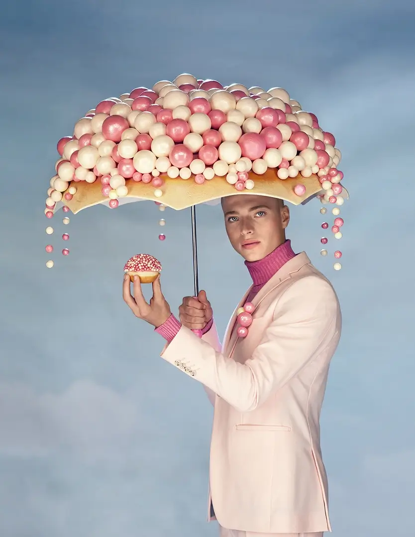 young beautiful man with donuts shot by Davidovitz