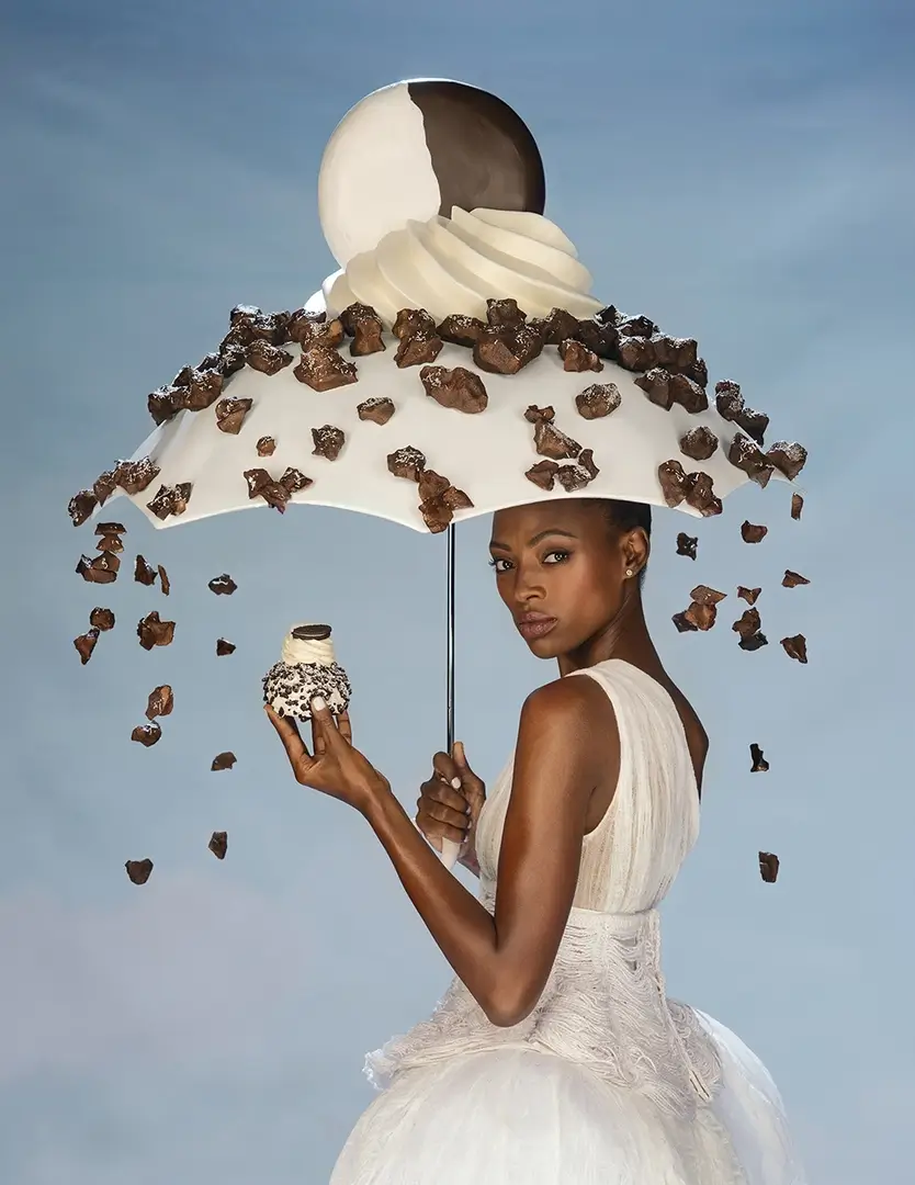 young woman holding umbrella